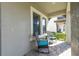 Cozy covered patio featuring outdoor seating, perfect for relaxing and enjoying the serene surroundings at 3767 Dragonfly Trl, Odessa, FL 33556