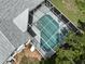 An aerial view of an enclosed pool, offering a serene and private oasis for relaxation and recreation at 4048 St Ives Blvd, Spring Hill, FL 34609