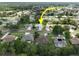 An aerial view of a well-maintained single-Gathering home on a tree-lined street in a peaceful neighborhood at 4048 St Ives Blvd, Spring Hill, FL 34609