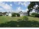 A comfortable single-story house with a screened lanai and a spacious yard, offering plenty of room for outdoor activities at 4048 St Ives Blvd, Spring Hill, FL 34609
