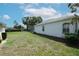 Wide, well-maintained backyard with manicured lawn and potential to create the outdoor living space of your dreams at 4048 St Ives Blvd, Spring Hill, FL 34609