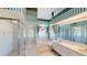Bright bathroom with glass shower, tub, double sink vanity and ample natural light at 4048 St Ives Blvd, Spring Hill, FL 34609