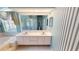 Large bathroom includes double sink vanity, shower, and bathtub at 4048 St Ives Blvd, Spring Hill, FL 34609