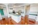 Bright kitchen with stainless steel appliances, island with sink, and modern fixtures at 4048 St Ives Blvd, Spring Hill, FL 34609