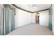 Spacious main bedroom with soft carpeting, smooth white walls, and a ceiling fan at 4048 St Ives Blvd, Spring Hill, FL 34609