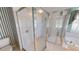 Bathroom shower enclosure with glass door and tiled walls, providing a clean and modern look at 4048 St Ives Blvd, Spring Hill, FL 34609