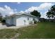 A tidy home featuring well-maintained lawns, offering privacy and a connection to nature in a peaceful neighborhood at 4048 St Ives Blvd, Spring Hill, FL 34609