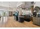 Entertainer's bar area, featuring a large counter, seating, and built-in shelving at 4348 Harborpointe Dr, Port Richey, FL 34668