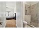 Bathroom featuring glass shower, with bedroom visible in background at 4348 Harborpointe Dr, Port Richey, FL 34668