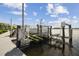 This waterfront property features a private dock with a boat lift for easy access to the water at 4348 Harborpointe Dr, Port Richey, FL 34668