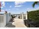 Private dock with waterfront access and lush landscaping creating a serene entrance to the property's amenities at 4348 Harborpointe Dr, Port Richey, FL 34668