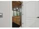 Private residential elevator with mirrored walls and wood accents at 4348 Harborpointe Dr, Port Richey, FL 34668