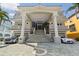 Elegant home with a grand entrance, stately columns, and lush landscaping and circular driveway at 4348 Harborpointe Dr, Port Richey, FL 34668