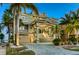 Stunning multi-story home with lush landscaping, grand staircase and three-car garage at 4348 Harborpointe Dr, Port Richey, FL 34668