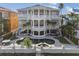 Luxury home showcasing balconies, a private pool, lush landscaping, and white exterior paint at 4348 Harborpointe Dr, Port Richey, FL 34668