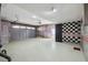 Spacious garage with high ceilings, ample storage, and stylish checkered accents at 4348 Harborpointe Dr, Port Richey, FL 34668
