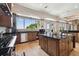 This kitchen has stainless steel appliances, granite countertops, and a view of the water at 4348 Harborpointe Dr, Port Richey, FL 34668