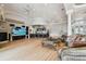 Large living space with high ceilings, a wet bar, fireplace, and floor to ceiling windows at 4348 Harborpointe Dr, Port Richey, FL 34668