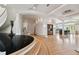 Open-concept living room featuring hardwood floors, elegant columns, and modern finishes at 4348 Harborpointe Dr, Port Richey, FL 34668