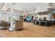 Large entertaining space with a fireplace, built-in shelves, bar, and views of the water at 4348 Harborpointe Dr, Port Richey, FL 34668