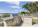 Enjoy outdoor cooking in the stone-clad kitchen with stainless steel grill, perfect for entertaining with waterfront views at 4348 Harborpointe Dr, Port Richey, FL 34668