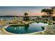 Enjoy waterfront views from the private pool and spa area, complete with lush landscaping and outdoor entertaining spaces at 4348 Harborpointe Dr, Port Richey, FL 34668