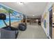 Spacious rec room with a beach-themed mural, comfortable seating, and ample space at 4348 Harborpointe Dr, Port Richey, FL 34668