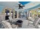 Unique sunroom with wall murals and a comfortable seating arrangement at 4348 Harborpointe Dr, Port Richey, FL 34668