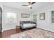 Bright bedroom with a modern ceiling fan, an area rug, and multiple windows allowing for abundant natural light at 435 11Th N Ave, St Petersburg, FL 33701