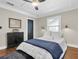 Bedroom with hardwood floors, modern decor, and tray ceilings at 435 11Th N Ave, St Petersburg, FL 33701