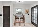 Charming dining area featuring barstool seating, a light fixture, and neutral walls, creating a cozy and inviting space at 435 11Th N Ave, St Petersburg, FL 33701