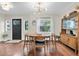 Dining room features a round table, mid-century modern decor, and natural light at 435 11Th N Ave, St Petersburg, FL 33701
