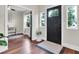 Inviting foyer with hardwood floors, and a stylish front door, enhanced by natural light from nearby windows at 435 11Th N Ave, St Petersburg, FL 33701