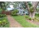 Charming home with a well-maintained front yard, featuring lush greenery and mature trees for added curb appeal at 435 11Th N Ave, St Petersburg, FL 33701