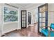Hallway with hardwood floors, french doors, and an open concept layout at 435 11Th N Ave, St Petersburg, FL 33701