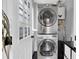 Efficient laundry room showcasing a stacked washer and dryer unit, and neutral walls, providing convenience and functionality at 435 11Th N Ave, St Petersburg, FL 33701