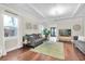Cozy living area with hardwood floors, stylish decor, and open to other rooms with lots of natural light at 435 11Th N Ave, St Petersburg, FL 33701