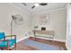 Bright home office featuring hardwood floors, a desk, and a comfortable chair at 435 11Th N Ave, St Petersburg, FL 33701