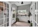 Bright sun room featuring tile flooring, neutral walls, and lots of plants, offering a tranquil and inviting atmosphere at 435 11Th N Ave, St Petersburg, FL 33701
