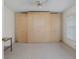 Bedroom featuring a large wardrobe at 4575 Whitton Way # 1132, New Port Richey, FL 34653