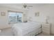 Bedroom with neutral carpet and a white bed at 4575 Whitton Way # 1132, New Port Richey, FL 34653