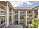 Exterior view of condo building featuring balconies, neutral paint, multiple stories, and staircases at 4575 Whitton Way # 1132, New Port Richey, FL 34653
