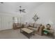 Cozy living room with neutral carpet, ceiling fan, natural light, and comfortable seating at 4575 Whitton Way # 1132, New Port Richey, FL 34653