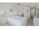 Bedroom showcasing neutral walls, carpet, and ensuite bathroom at 4575 Whitton Way # 1132, New Port Richey, FL 34653