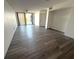 Spacious living room area with sliding glass doors to the balcony at 4823 Ebbtide Ln # 105, Port Richey, FL 34668