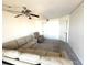 A condo's living room with a recliner and sectional sofa at 4823 Ebbtide Ln # 105, Port Richey, FL 34668