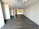 Spacious living room with ceiling fan and hardwood floors at 4823 Ebbtide Ln # 105, Port Richey, FL 34668