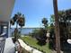 Scenic water view from the property with palm trees and lush landscaping adding to the property's charm at 4823 Ebbtide Ln # 105, Port Richey, FL 34668