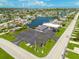 Aerial view of commercial property with ample parking and surrounding neighborhood, showcasing a prime location at 4917 Marlin Dr, New Port Richey, FL 34652