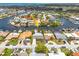 Aerial view showing waterfront home with private boat dock and canal system in neighborhood at 4917 Marlin Dr, New Port Richey, FL 34652